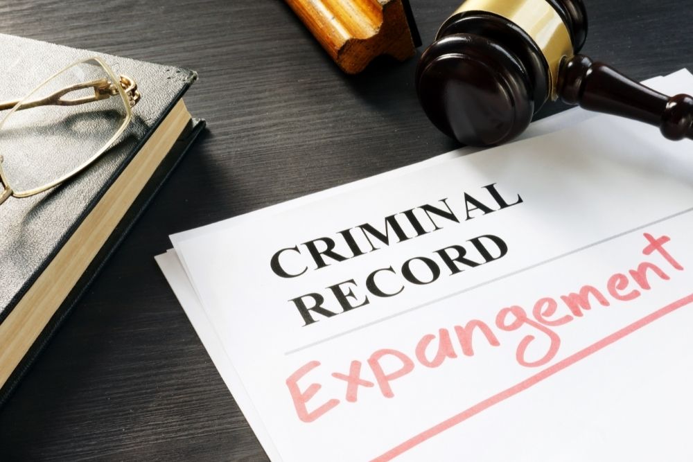 A background check reveals a fabricated criminal record; what should I do?